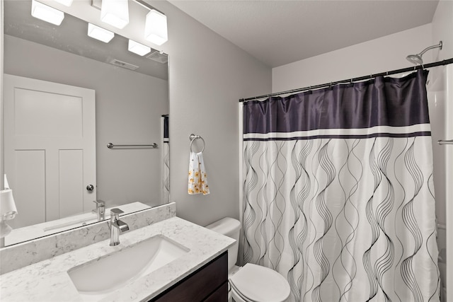 17127 Blue Sage Ln, Urbandale, IA 50323 - bathroom featuring vanity, toilet, and curtained shower
