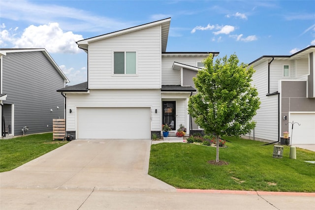 17127 Blue Sage Ln, Urbandale, IA 50323 - view of front facade featuring a garage, driveway, and a front yard