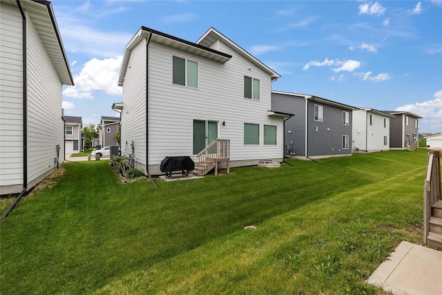 17127 Blue Sage Ln, Urbandale, IA 50323 - rear view of property with entry steps, a lawn, and a residential view