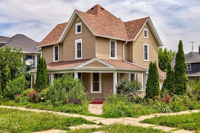 301 N 4th St, Marshalltown, IA 50158 - view of front of house with a porch and roof with shingles