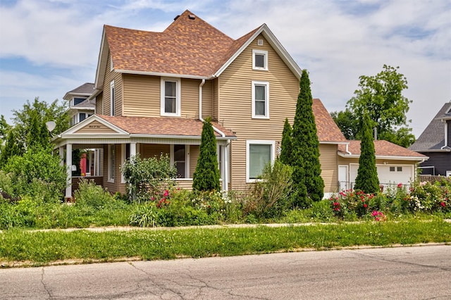 301 N 4th St, Marshalltown, IA 50158 - view of front of home with a shingled roof and covered porch
