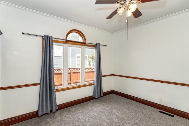 301 N 4th St, Marshalltown, IA 50158 - carpeted empty room featuring crown molding and a ceiling fan