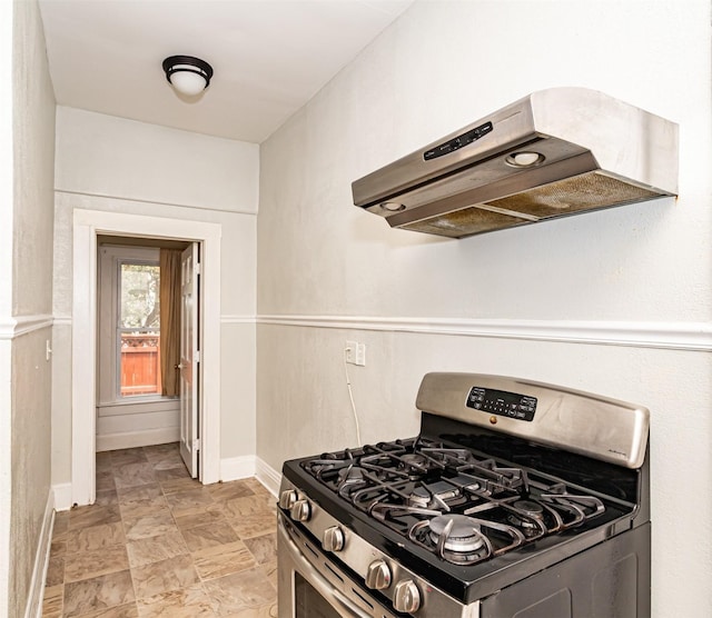 301 N 4th St, Marshalltown, IA 50158 - kitchen with stainless steel gas range oven and under cabinet range hood