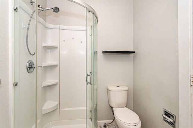 301 N 4th St, Marshalltown, IA 50158 - bathroom with a shower stall and toilet
