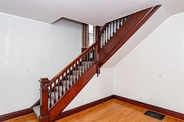 301 N 4th St, Marshalltown, IA 50158 - staircase featuring baseboards and wood finished floors
