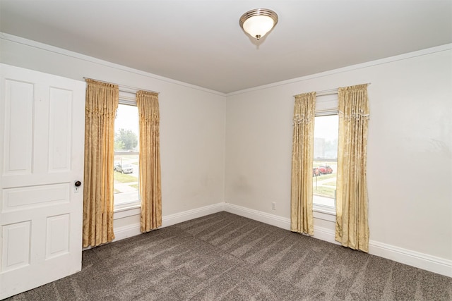 301 N 4th St, Marshalltown, IA 50158 - empty room featuring dark colored carpet and crown molding