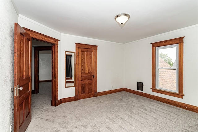 301 N 4th St, Marshalltown, IA 50158 - unfurnished room featuring light carpet and ornamental molding