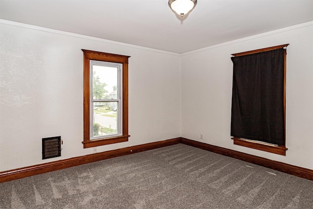 301 N 4th St, Marshalltown, IA 50158 - spare room with dark colored carpet and ornamental molding