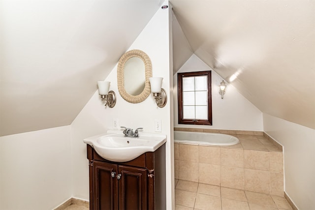 301 N 4th St, Marshalltown, IA 50158 - bathroom featuring vaulted ceiling, vanity, a bath, and tile patterned floors