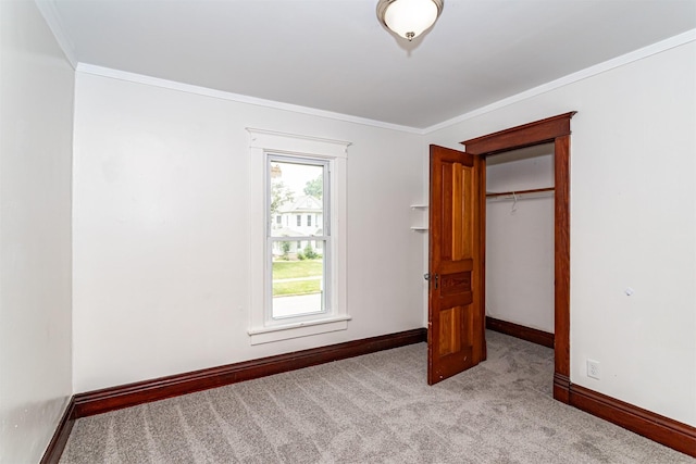 301 N 4th St, Marshalltown, IA 50158 - unfurnished bedroom featuring carpet, crown molding, and a closet