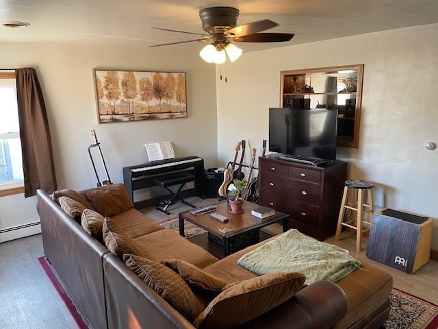 320 1st Ave, Grinnell, IA 50112 - living area with ceiling fan and baseboard heating