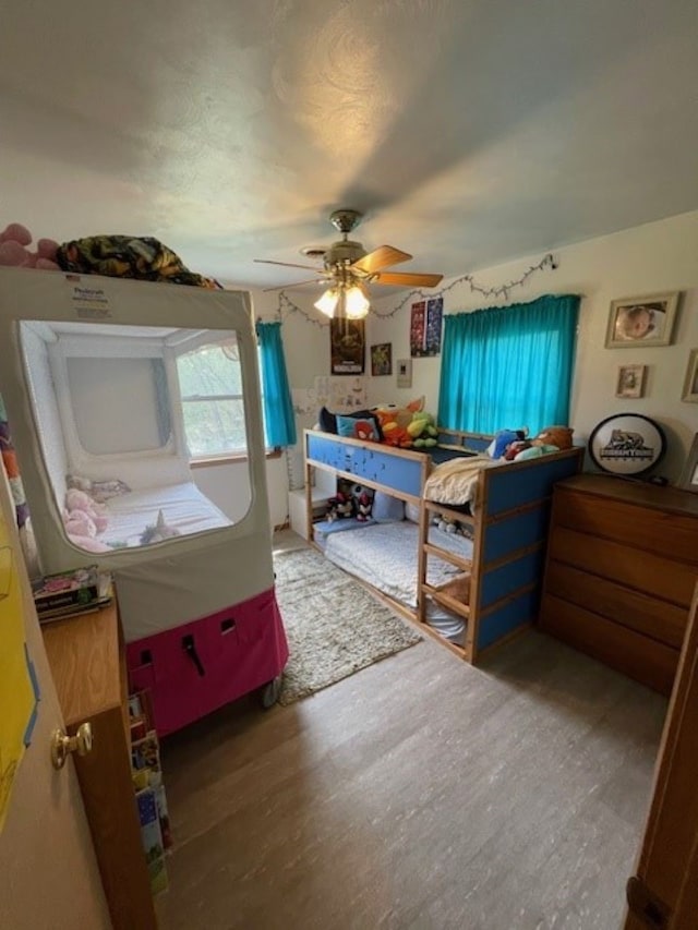 320 1st Ave, Grinnell, IA 50112 - bedroom featuring a ceiling fan and wood finished floors