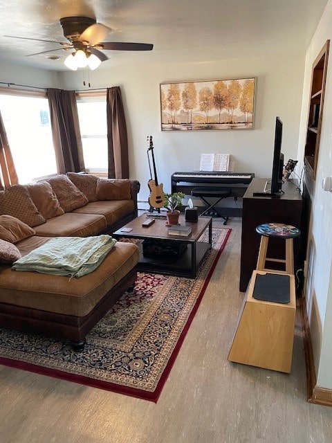 320 1st Ave, Grinnell, IA 50112 - living room featuring wood finished floors and ceiling fan