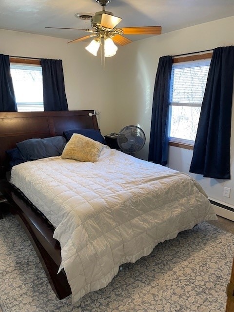 320 1st Ave, Grinnell, IA 50112 - bedroom featuring a ceiling fan and wood finished floors
