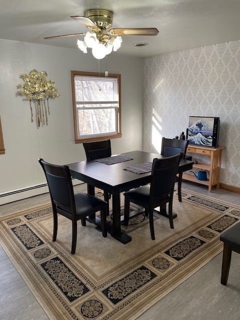 320 1st Ave, Grinnell, IA 50112 - dining room with a ceiling fan and baseboard heating