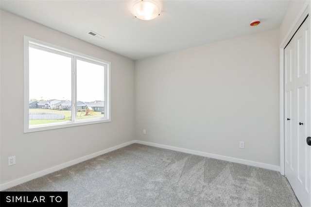 1012 Willow Valley Dr, Norwalk, IA 50211 - unfurnished bedroom with a closet, carpet floors, visible vents, and baseboards