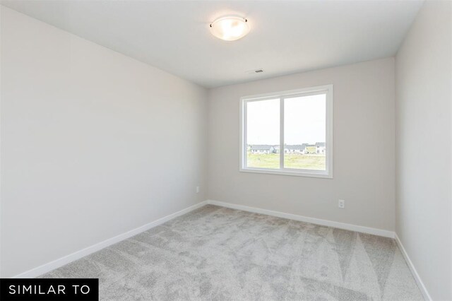 1012 Willow Valley Dr, Norwalk, IA 50211 - carpeted empty room with baseboards