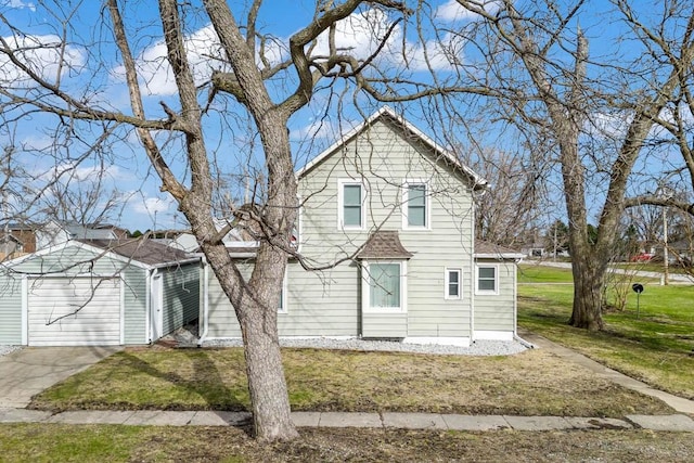 308 Pine St, Williams, IA 50271 - traditional home with a front yard, a garage, and an outbuilding