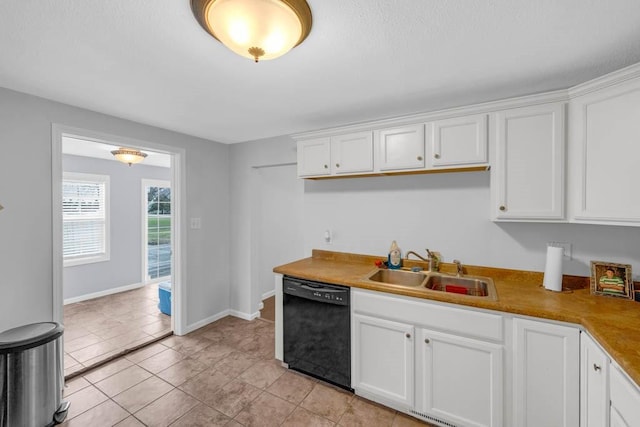 308 Pine St, Williams, IA 50271 - kitchen featuring white cabinets, baseboards, dishwasher, a sink, and light tile patterned flooring