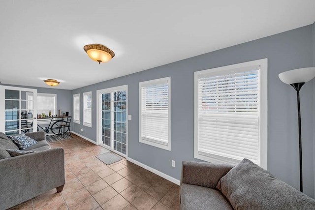 308 Pine St, Williams, IA 50271 - living area featuring light tile patterned floors and baseboards