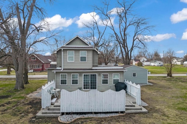 308 Pine St, Williams, IA 50271 - rear view of house with a yard, a wooden deck, and a shingled roof