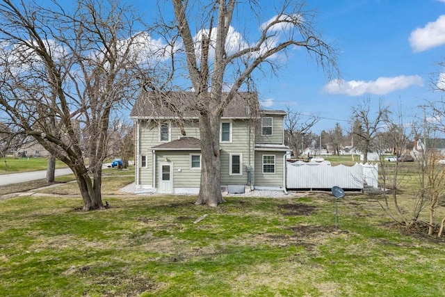 308 Pine St, Williams, IA 50271 - back of house with roof with shingles and a lawn