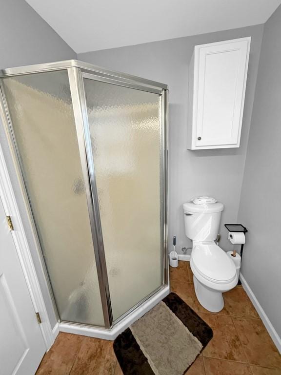 308 Pine St, Williams, IA 50271 - full bath featuring tile patterned flooring, toilet, a stall shower, and baseboards