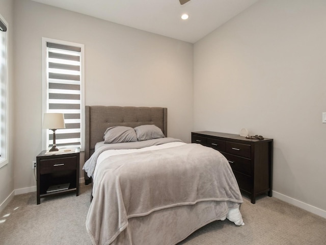 804 E 2nd St, Des Moines, IA 50309 - bedroom featuring baseboards, multiple windows, and light colored carpet