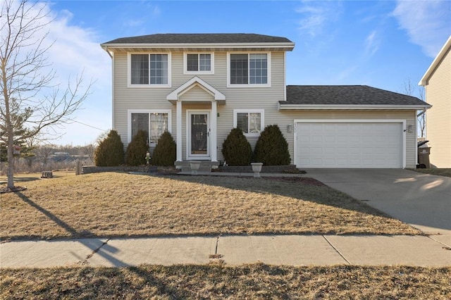 400 Coral Ridge Blvd, Pleasant Hill, IA 50327 - colonial house featuring concrete driveway, a garage, and roof with shingles