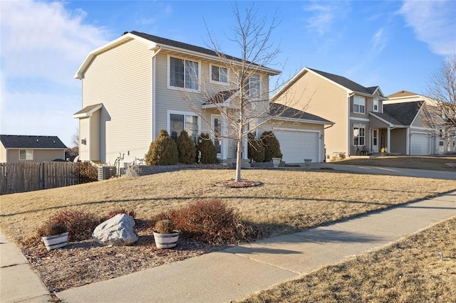 400 Coral Ridge Blvd, Pleasant Hill, IA 50327 - view of front of home featuring driveway, an attached garage, and fence