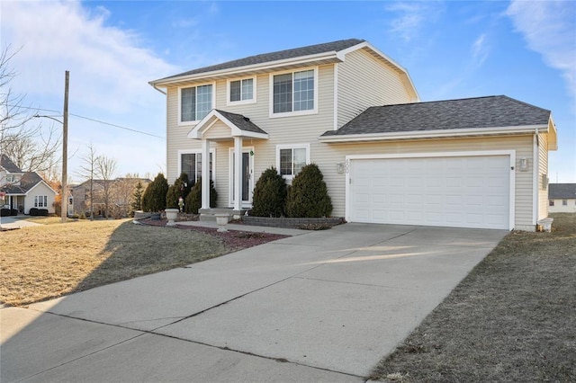 400 Coral Ridge Blvd, Pleasant Hill, IA 50327 - colonial home with a garage, concrete driveway, and roof with shingles