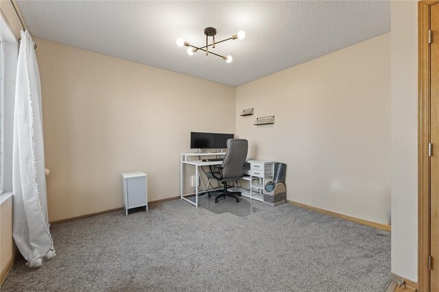 400 Coral Ridge Blvd, Pleasant Hill, IA 50327 - office area with carpet, baseboards, a chandelier, and a textured ceiling