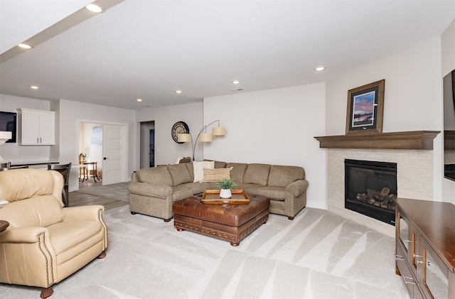 2426 SW Vineyard Ln, Ankeny, IA 50023 - living area featuring recessed lighting, a glass covered fireplace, and light carpet