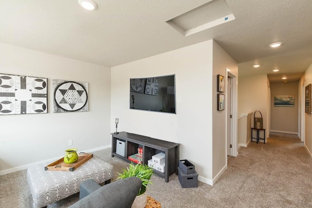 14521 Ironwood Ct, Urbandale, IA 50111 - carpeted living room featuring a textured ceiling, attic access, baseboards, and recessed lighting