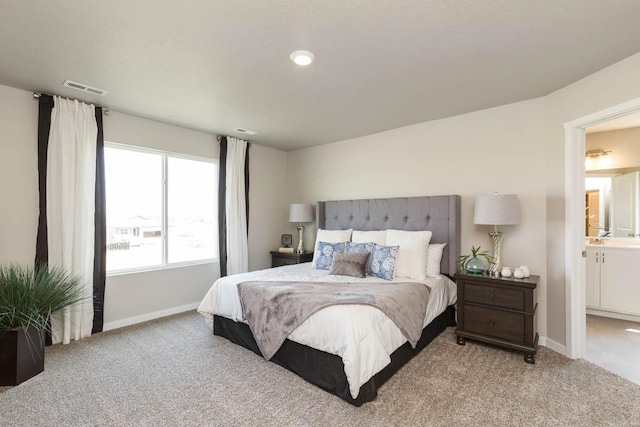 14521 Ironwood Ct, Urbandale, IA 50111 - carpeted bedroom featuring visible vents and baseboards