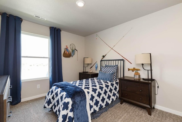 14521 Ironwood Ct, Urbandale, IA 50111 - bedroom featuring light carpet, visible vents, and baseboards