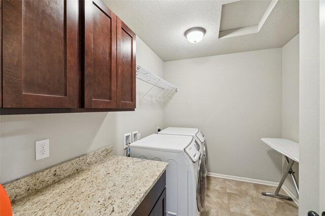250 NE Fox Run Trl, Waukee, IA 50263 - laundry room with cabinet space, separate washer and dryer, baseboards, and a textured ceiling