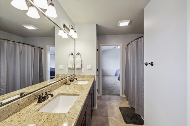250 NE Fox Run Trl, Waukee, IA 50263 - bathroom with double vanity and tile patterned flooring