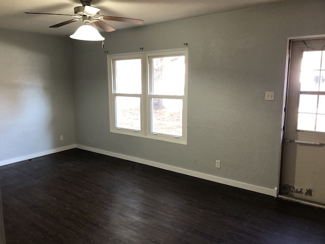 1032 69th St, Windsor Heights, IA 50324 - unfurnished room featuring dark wood-type flooring and ceiling fan