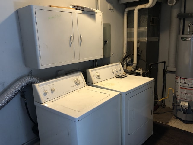 1032 69th St, Windsor Heights, IA 50324 - laundry room with washing machine and dryer, gas water heater, and cabinet space