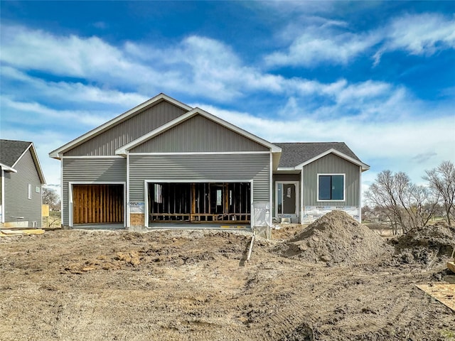 back of house featuring an attached garage and board and batten siding