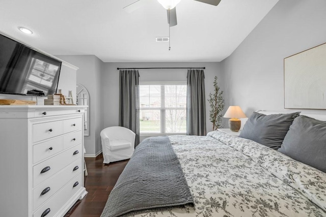 2403 NE Oak Dr Unit 6, Ankeny, IA 50021 - bedroom with dark wood-style flooring, visible vents, ceiling fan, and baseboards