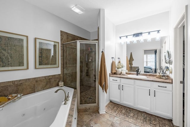 2403 NE Oak Dr Unit 6, Ankeny, IA 50021 - bathroom with a jetted tub, ensuite bath, vanity, and a stall shower
