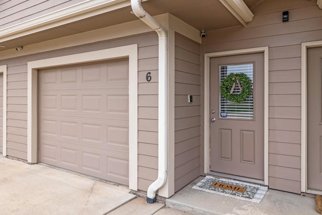 2403 NE Oak Dr Unit 6, Ankeny, IA 50021 - view of exterior entry featuring a garage