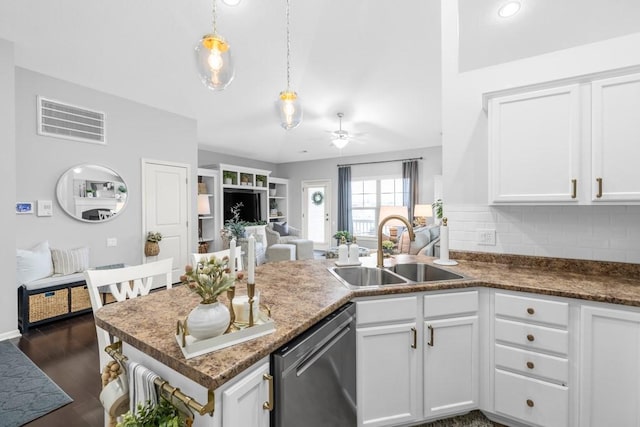2403 NE Oak Dr Unit 6, Ankeny, IA 50021 - kitchen with open floor plan, a ceiling fan, visible vents, stainless steel dishwasher, and a sink