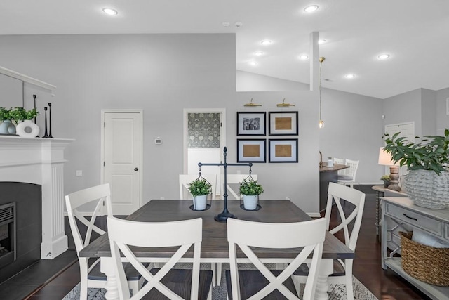 2403 NE Oak Dr Unit 6, Ankeny, IA 50021 - dining area featuring dark wood-type flooring, recessed lighting, a glass covered fireplace, and lofted ceiling