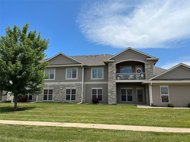 2403 NE Oak Dr Unit 6, Ankeny, IA 50021 - view of front of home with a front yard, stone siding, and a balcony