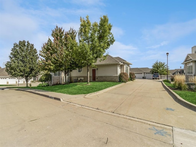 1417 NW 141st St Unit 17, Clive, IA 50325 - view of front facade featuring a residential view and a front lawn