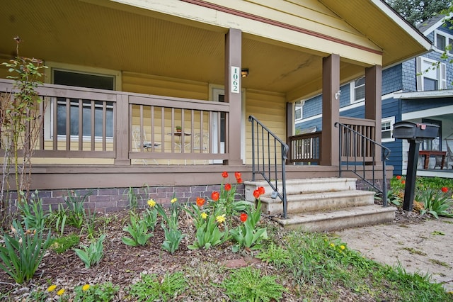 doorway to property with a porch