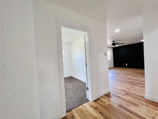 1402 E Marion St, Knoxville, IA 50138 - corridor featuring baseboards and wood finished floors